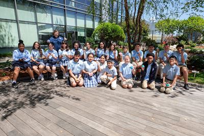 Becky Gall-Piorek and her sixth-grade students from Assumption Catholic School in Fairfield show off their hand-painted rocks in Smilow’s Healing Garden 